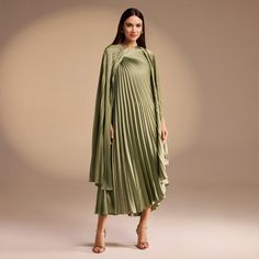 Indulge in luxury with our Cape Pleated Satin Midi Dress. Crafted from flowing, silky satin, this dress exudes elegance and sophistication. Its cape pleats add a touch of drama, while the highest quality fabric ensures a flawless drape. Perfect for any occasion, this dress will elevate your look to a whole new level. Pleated Fabric Dress, Hari Raya, L And Light, Pleated Fabric, Satin Midi Dress, Elevate Your Look, Xl Dress, Satin Dresses, Dress Fabric