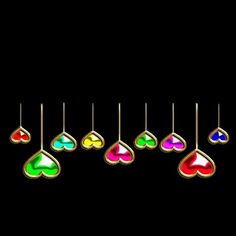 six different colored hearts hanging from the end of a line on a black background,