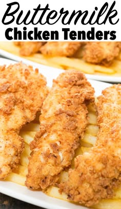 two white plates topped with fried chicken and french fries