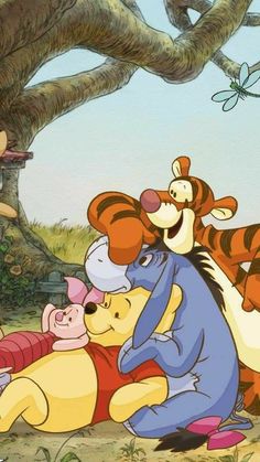 winnie the pooh and tigger hugging under a tree with other characters around them