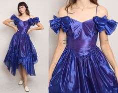 FEATURES - 1980s dress - Indigo blue-ish purple color - Romantic prairie / fairy style - Formal evening wear / prom vibes - Iridescent organza fabric - Off the shoulder silhouette - Spaghetti straps - Ruched sleeves - Fitted waistline - Tea length skirt with an asymmetric hanky hem - Zips up the left side of the waist - Lined body CONDITION Great vintage condition: a few light markings on the dress that are almost impossible to notice because of the fabric sheen and full skirt. MEASUREMENTS & FIT suggested letter size: XS/S (tag is marked a vintage women's US 7) bust (underarm): 32"-33" waist: 26"-27" max hip: 44" length: 48"-54" shoulder to waist: 15"-18.5" color: indigo blue-ish purple material: polyester, acetate, zipper label: Steppin' Out pinned on model? no Note on fit: Adrianne is 5 80s Formal Fashion, 80s Dresses Formal, Violet Prom Dresses, 80s Formal Dress, Queer Prom, Prom Vibes, 80s Prom Party, Iridescent Organza, 1980s Prom Dress