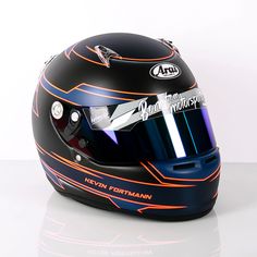 a helmet with an orange and blue stripe on the side is sitting in front of a white background