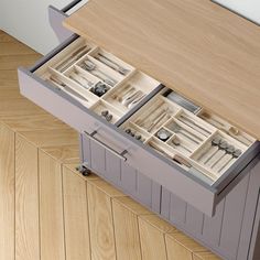 an open drawer on top of a wooden table