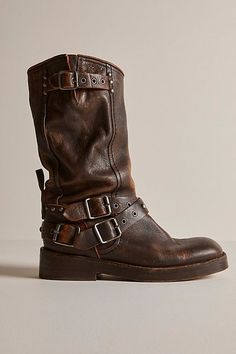 Bring out your inner rebel with these rough-and-tough, buckled-adorned boots from We The Free. **Features:** Mid-calf length, pull-on style, vegetable-tanned leather uppers, round toe, grommet buckle accents at topline and vamp, slight heel, studded details **Why We | We The Free Janey Engineer Boots at Free People in Brown, Size: US 6 Brown Rugged Moto Boots With Buckle Closure, Rugged Boots With Buckle Closure For Fall, Rugged Fall Boots With Buckle Closure, Rugged Leather Moto Boots With Rivets, Brown Leather Punk Boots, Punk Brown Leather Boots, Rugged Distressed Brown Moto Boots For Fall, Rugged Leather Moto Boots For Fall, Rugged Moto Boots With Rivets For Fall