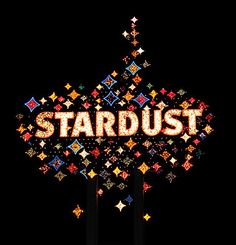 the word stardust is lit up in front of a black background with multicolored stars