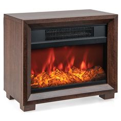 an electric fireplace heater with flames in the center and wood frame, on a white background