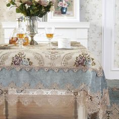 a table topped with a vase filled with flowers