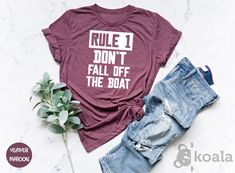 Rule 1 Don't Fall Off The Boat Shirt, Boating Captain Gifts, Boat Shirt, Sail Shirt, Boating Sailing Shirt, Cruise Shirt, Boat Captain Shirt  Please Check All Photos for Details  * Due to monitor differences, actual colors may vary slightly from what appears online * I'm working with different brands based on the availability. Different styles of shirts may have different shades of same color due to different manufacturer brands. If you have a preferred brand, please let me know.  DESIGN COLOR Captain Gifts, Boat Shirts, Church Shirt, Cruise Shirt, Boat Race, Mom Tees, Love Shirt, The Boat, Christian Shirts