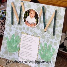 a handmade card with an image of a baby in the middle and green cactus on it