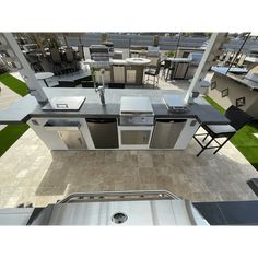 an aerial view of a kitchen with stainless steel appliances