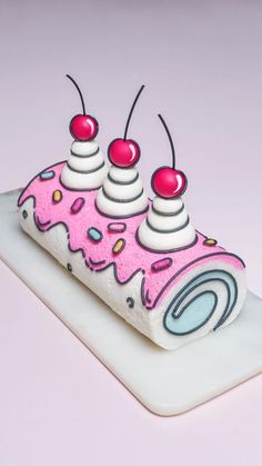 a cake with pink icing and sprinkles on it