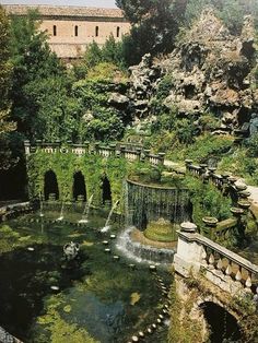 a small waterfall in the middle of a park