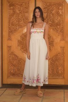 Add a touch of whimsy to your wardrobe with the Serena Dress. This midi dress features delicate embroidered floral details on a crisp linen white fabric, and smocked back detailing, perfect for a playful yet sophisticated look. Embrace the beauty of spring in style! Serena Dress, Embroidered Summer Dress, Swim Cover Up Dress, White Embroidered Dress, Floral Babydoll Dress, Embroidered Midi Dress, Crop Top Tees, Plus Size Sweaters, Jumpsuit Shorts Rompers