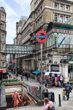 people are walking down the street in london