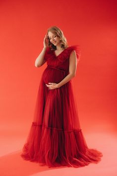 "The red wine dress, a symbol of timeless beauty, complements your changing silhouette with its flowing lines and luxurious fabric. Indulge in the perfect blend of comfort and style with our maternity maxi dress, designed to enhance the beauty of pregnancy in every frame. Elevate your pregnancy photoshoot experience with a touch of opulence and capture the magic of this special journey. As part of our Black Friday promotion, explore our plus-size gown collection. * Dress name: Charlotte * Large color palette - contact our manager for detailed information * Size: XS-S, S-M, M-L, L-XL, XL-2XL, 2XL-3XL, 3XL-4XL, CUSTOM SIZE * Shipping: 7-14 business days. FREE SHIPPING * Processing time: 10-14 business days For a better fit please measure yourself and send me your measurements: -Your height - Photo Shoot Style, Red Wine Dress, Red Tulle Dress, Tulle Maternity Dress, Dress For Photoshoot, Lace Up Back Dress, Red Ball Gown, Maternity Shoots, Dress Name