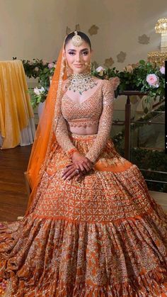 A stunning orange bridal lehenga brings a burst of color and elegance to your special day. This vibrant outfit, adorned with intricate embroidery and beautiful embellishments, reflects joy and celebration. The rich hue of orange symbolizes warmth and happiness, making it perfect for weddings. Paired with matching jewelry and accessories, this lehenga enhances the bride's beauty and grace. Whether you're walking down the aisle or dancing the night away, an orange bridal lehenga will surely make you stand out and create unforgettable memories. Embrace the tradition while showcasing your unique style with this gorgeous ensemble!

#shaadidukaan#weddingplanning#lehenga#bride#groom Bridal Mehndi Lehenga, Orange Pakistani Bridal Dress, Light Decorations Wedding, Long Sleeve Bridal Lehenga, Bridal Lehenga Indian, Best Indian Wedding Dresses, Baju Kahwin, Lehenga Indian, Orange Lehenga