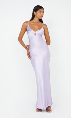 A bestselling design, the BEC + BRIDGE Cedar City Maxi Dress is a slinky V-neck style with a keyhole cut-out detail and contrast binding that carries through straps to tie-back. The bias-cut maxi is finished with a rolled hem, and an adjustable knotted strap which can be loosened and tied at desired length. This garment is certified Australian made. Lilac Hoco Dress, Lilac Satin Dress, Light Purple Dress, Cedar City, Bec Bridge, Prom Dress Styles, Mini Dress Formal, Bridesmaid Dresses Prom, Lilac Dress