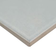 a close up view of a sheet of white paper on a white background with clippings