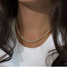 Beautiful, High Quality Tennis Chain Necklace Featuring Round Cubic Zirconia Stones. A Sophisticated Necklace To Add Glam To Your Look! Available In Silver Or Gold 18k White Gold Or Gold Plating Over Metal Alloy Highest Quality Cubic Zirconia Stones Available Lengths: 16", 18" Available Thicknesses/Widths: 3mm, 4mm, Or 5mm This Item Is Plated To Resist Against Tarnishing. Over Time, Plated Jewelry May Tarnish And To Prevent This, We Recommend Avoiding Exposure To Water, Sweat, Etc To Ensure The Dainty Gold Tennis Necklace With Cubic Zirconia, Silver Tennis Necklace With Ethical Diamonds, Silver Crystal Tennis Necklace With Clavicle Chain, Elegant Gold Tennis Necklace With Rhinestones, Gold Cubic Zirconia Tennis Necklace, Round Rhinestone Tennis Necklace, Gold Tennis Necklace For Gift, Fine Jewelry Style, Classic Gemstone Tennis Necklace - Gift, Diamond Tennis Necklace