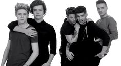 the one direction photo has been altered to say, what do you think? that boyband you like is so gay?