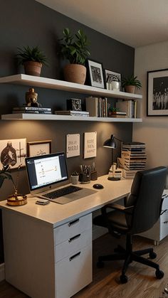 a desk with a laptop computer sitting on top of it next to a book shelf