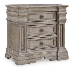 an antique style night stand with drawers