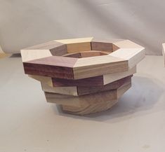 two pieces of wood sitting on top of each other