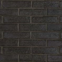 a black brick wall with no mortars or mortars on the bottom and sides