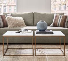 a living room scene with focus on the couch and coffee table in the center area