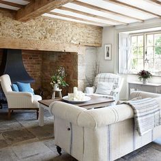 a living room filled with furniture and a fire place