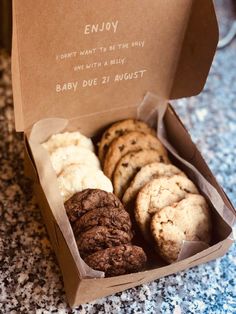 a box filled with lots of cookies on top of a counter