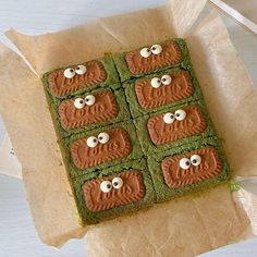 there are four square cookies with eyes on them