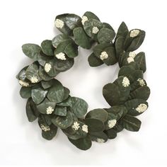 a wreath made out of green leaves and white flowers