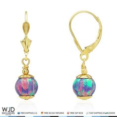 These elegant dangle earrings are decorated with ball shaped purple fire opal gemstones. The earrings are crafted in 14K solid yellow gold and safely secured with comfortable leverback closure. Perfect for any occasion these earrings will complete any formal or casual look. Metal 14k Yellow Gold Style Purple Fire Opal Ball Dangle Drop Leverback Earrings Finish High Polished Earring Type Dangle (Drop) Gem Fire Opal Main Stone Shape Ball Main Stone Creation Synthetic Fastening Leverback Earring Di Heart Accessories, Purple Fire, Gold Jewelry Earrings, Leverback Earrings, Silver Shop, Earring Type, Belly Rings, Toe Rings, Opal Gemstone