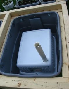 an outdoor hot tub in a wooden box