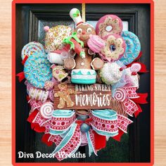 a wreath made out of cookies, doughnuts and other holiday treats is hanging on a door