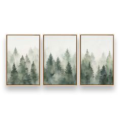 three green and white paintings hanging on the wall in front of a white wall with trees