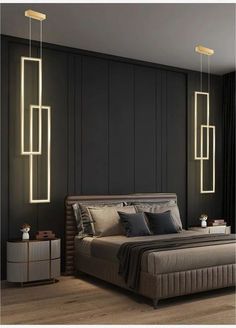 a modern bedroom with black walls and wooden flooring, along with two hanging lights above the bed