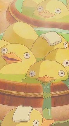 a bunch of yellow ducks sitting in a basket