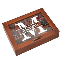 a wooden box with the word morgan on it's glass front and bottom window