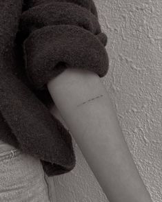 a person with a small tattoo on their arm