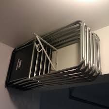 there are many metal racks on the wall