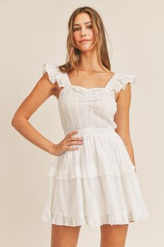 -Color: Off White -Sleeveless -Dotted swiss -Ruffle tier -Smocked bodice -Content: Self 100% Cotton; Lining 100% Rayon -Hand wash/Line dry -Imported -Model is 5'9" and wearing a size Small Tiered Cotton Mini Dress With Smocked Back, Sleeveless Cotton Tiered Dress For Daywear, Cotton Sleeveless Tiered Dress For Day Out, Sleeveless Cotton Tiered Dress For Day Out, Cotton Tiered Dress With Smocked Bodice, White Sleeveless Cotton Tiered Dress, White Sleeveless Casual Tiered Dress, Casual White Sleeveless Tiered Dress, Cotton Smocked Mini Dress With Ruffles