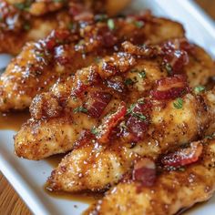 chicken with sauce and herbs on a white plate