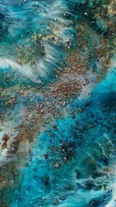 an abstract painting with blue and brown colors