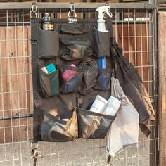 an iron gate with various items hanging on it