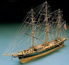 a model ship on a blue surface with the name mantua written in it