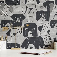 a wall with dogs on it in black and white