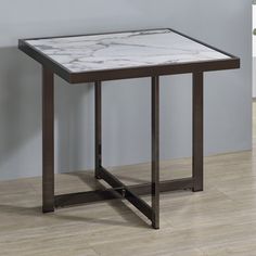 a marble top end table with metal legs in a living room or dining room area