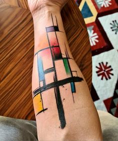 a person with a colorful tattoo on their arm